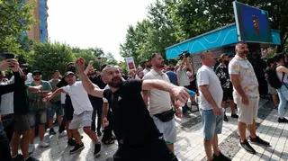 A protestor throws eggs as violent clashes erupt