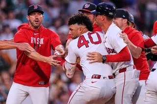 Willson Contreras is held back by teammates as tempers flared in Tuesday’s game.