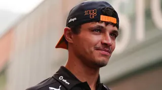 McLaren's Lando Norris wearing a McLaren cap back to front