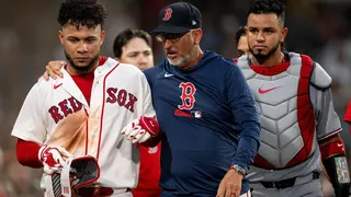 Willson Contreras #40 reacts with Interim Bench Coach José David Flores #58 after ejection at Fenway Park.