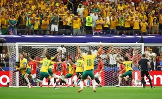 Australia’s Harry Souttar and Nestory Irankunda celebrate after Egypt’s Mohamed Hany scored an own goal.