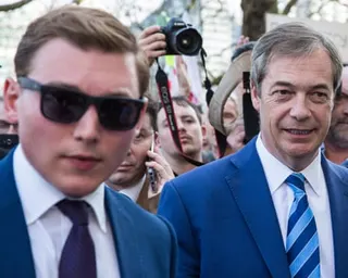 George Cottrell, left, pictured with Nigel Farage at a pro-Brexit rally in London in 2019