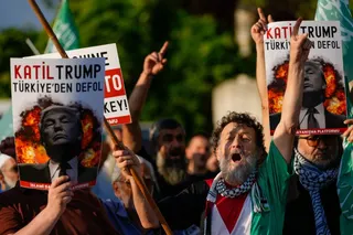 Protesters hold posters with the image of US President Donald Trump during a demonstration against the coming Nato summit in Istanbul, Turkey, on Saturday. Photo: AP