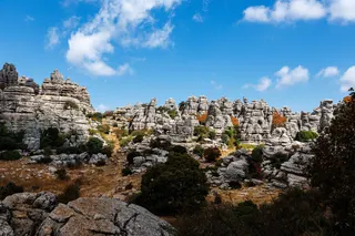 25 September 2025, Spain, Antequera: The "Paraje Natural Torcal de Antequera" nature park near Antequera (province of Malaga, Andalusia, Spain). The spectacular natural park is known for its bizarre karst rocks, which have been formed from limestone by millions of years of erosion and are often reminiscent of sculptures. As a UNESCO World Heritage Site, it offers unique hiking trails, a rich flora and fauna and is an important protected area for geology and biodiversity. (landscape, nature, excu