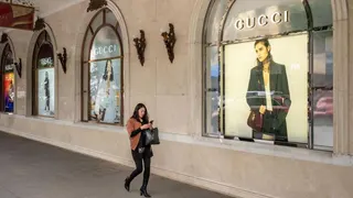 Advertisements for Versace, left, and Gucci at the Trang Tien Plaza luxury shopping center in downtown Hanoi, Vietnam, on Tuesday, Feb. 27, 2024.