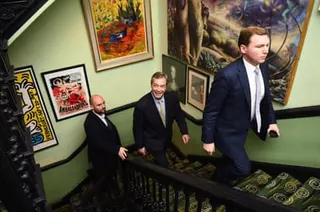 Cottrell, Farage and another man walking up a staircase