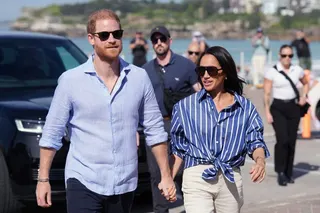 Prince Harry and Meghan markle, the Duke and Duchess of Sussex, during a visit to Bondi Beach in Australia in  April. Photo: Pool Photo via AP