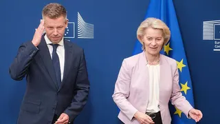 Hungarian Prime Minister Peter Magyar (L) reacts as he is welcomed by the President of the European Commission Ursula von der Leyen (R) prior a bilateral meeting in the Berlaymont building