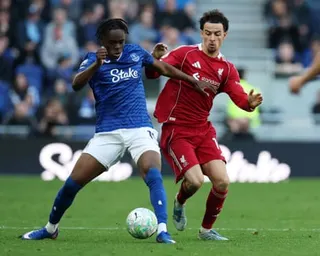 Liverpool's Curtis Jones in action with Everton's Tyrique George