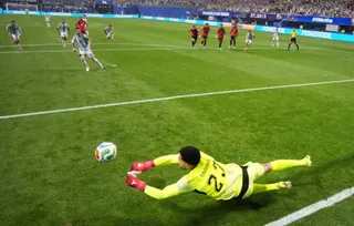 Egypt's Mostafa Shobeir saves a penalty missed by Argentina's Lionel Messi