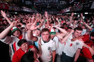 England fans celebrate in a crowd.