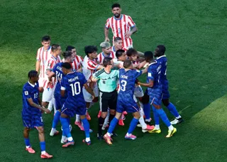 France's Ousmane Dembele clashes with Paraguay players after Andres Cubas fouls Kylian Mbappe