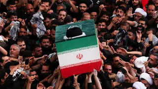 The coffin of Iran's late Supreme Leader Ayatollah Ali Khamenei is carried during a funeral procession at the Imam Ali shrine in Najaf, Iraq (8 July 2026)