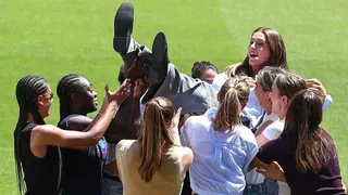 Alexia Putellas is lifted in the sky by her team-mates