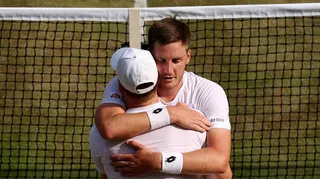 Henry Patten embraces team-mate Harri Heliovaara after winning their semi-final
