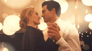 Sarah Pidgeon as Carolyn Bessette Kennedy dancing with Paul Kelly as John F Kennedy Jr in a still from Love Story