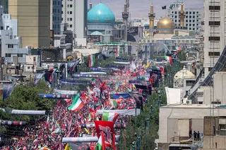 Thousands of mourners gather on a boulevard in Mashhad, northeastern Iran, ahead of the burial of Iran's late Supreme Leader Ayatollah Ali Khamenei (9 July 2026)