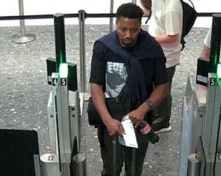 A still from CCTV footage shows Tshuma going through what appear to be border control barriers.