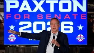 Paxton in front of Paxton for Senate 2026 sign
