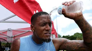 Ezri Konsa pours water on himself