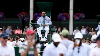 An umpire sits in a chair at Wimbledon