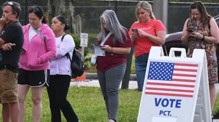 Voters queue-up outside a polling station in Florida