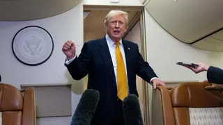 President Donald Trump speaks with reporters aboard Air Force One after landing at the US Air Force Base at RAF Mildenhall, in Suffolk Eastern England, on July 8, 2026