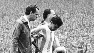 Argentinian national soccer team captain and midfielder Antonio Rattin bows his head as he walked off the field after being sent off by German referee Rudolf Kreitlein 23 July 1966 at Wembley stadium in London