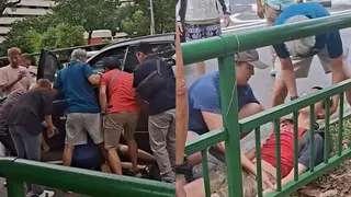 14岁少年车祸后卷入车底  热心路人合力抬车救人