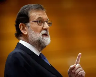 Mariano Rajoy makes a pointing gesture as he speaks in parliament