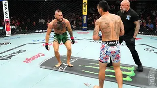 Conor McGregor and Max Holloway in the octagon