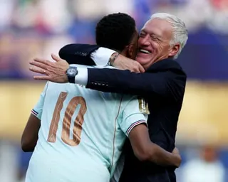 Didier Deschamps and Kylian Mbappé hug after France’s win over Morocco
