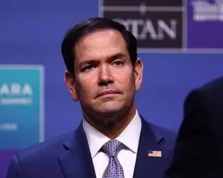 a man in a suit and tie with a serious expression