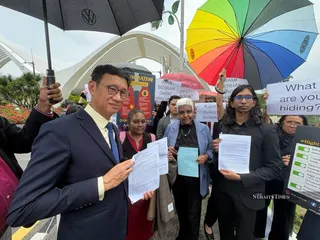 Centre for Independent Journalism (CIJ) executive director Wathshlah Naidu (third from left), Subang MP Wong Chen (left) and members of civil society groups during a peaceful gathering outside the Dewan Rakyat gates on the proposed Freedom of Information Bill 2026. NSTP/Ahmad Mukhsein Mukhtar