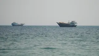 Two vessels in the Strait of Hormuz, as seen from Musandam, Oman.