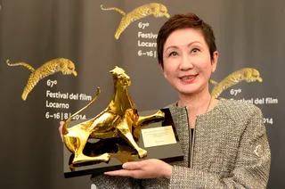 Shi Nan-sun with her award for best independent producer at the 67th Locarno International Film Festival in 2014. Photo: EPA
