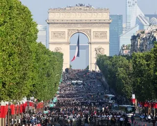 Troops get ready for the annual Bastille Day military parade on the Champs-Elysees Avenue with the Arc de Triomphe in the background in Paris.