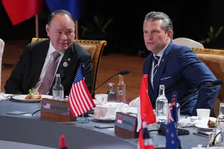 US Secretary of Defence Pete Hegseth (right) confers with Philippine Defence Secretary Gilberto Teodoro Jnr during a meeting of the Association of Southeast Asian Nations (Asean) in Kuala Lumpur on November 1, 2025. Photo: EPA