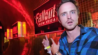 Aaron Paul pointing at a Fallout sign at a Fallout New Vegas launch event in 2010