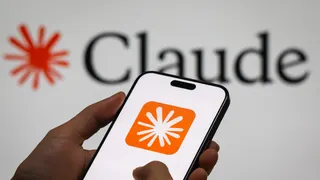 CHONGQING, CHINA - DECEMBER 29: In this photo illustration, a person holds a smartphone displaying the logo of “Claude,” an AI language model by Anthropic, with the company’s logo visible in the background, illustrating the rapid development and adoption of generative AI technologies, on December 29, 2024 in Chongqing, China. Artificial Intelligence (AI) has become a cornerstone of China’s strategic ambitions, with the government aiming to establish the country as a global leader in AI by 2030.