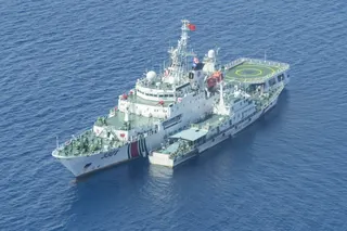 A China Coast Guard ship sails near Scarborough Shoal in the South China Sea on June 18. Photo: Kyodo