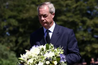 Nigel Farage lays flowers near the home of former government minister and Reform UK party member Ann Widdecombe on Saturday. Photo: Reuters