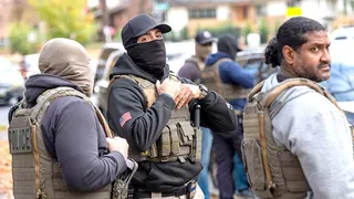 ICE agents check cars for illegal immigrants.