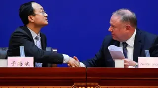 Yu Haibin and Austin Moore at Thursday's news conference