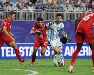 Argentina's Lionel Messi attempts to dribble past several players during the World Cup quarter-final against Switzerland
