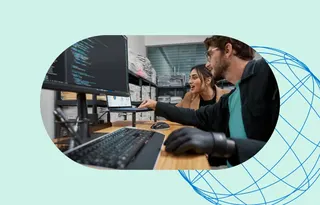 two people looking at computers