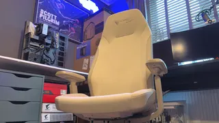 A Secretlab Atlas gaming chair in a home office during set-up and after it's completed.