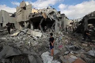 Palestinians inspect the site of an Israeli strike at the Bureij refugee camp in central Gaza Strip, on July 16, 2026