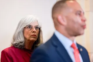 a woman looks at a man who’s speaking