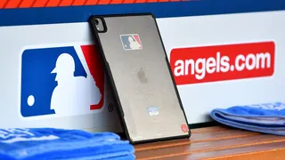 An iPad sits in the dugout during an MLB game.